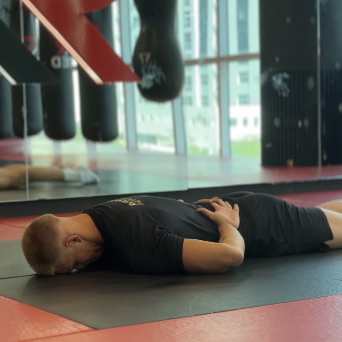 Prone thoracic rotation mobility drill